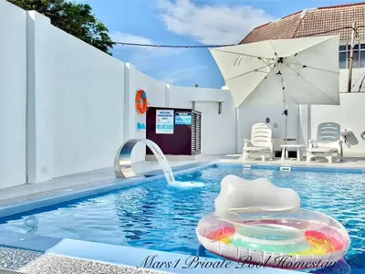 a swimming pool with a float in the middle of it at Mars1 Private Pool Homestay in Ipoh