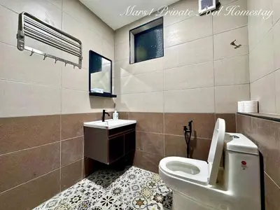 a bathroom with a toilet and a sink at Mars1 Private Pool Homestay in Ipoh