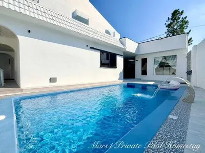 a swimming pool in front of a house at Mars1 Private Pool Homestay in Ipoh