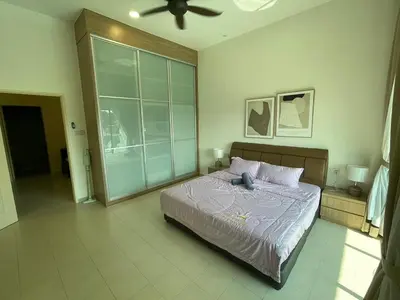 a bedroom with a bed and a ceiling fan at Pangkor Villa 16 Homestay 4Rooms 3Bathroom Free WIFI & Karaoke in Pangkor