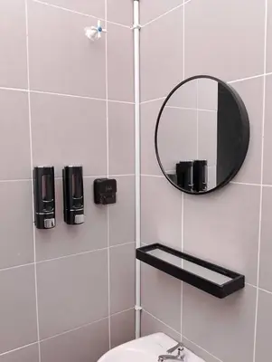 a bathroom with a mirror and a toilet at Nazana Homestay in Batu Gajah