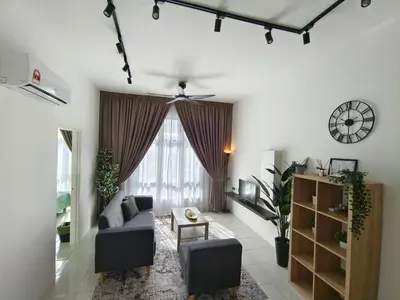 a living room with a couch and a table at Apartment In Ipoh, City View in Ipoh