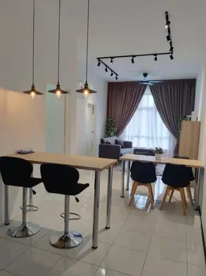 a living room with two tables and chairs and a couch at Apartment In Ipoh, City View in Ipoh