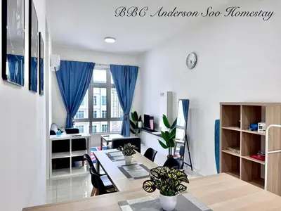 a living room with a dining room table and a desk at BBC Anderson Soo Homestay in Ipoh