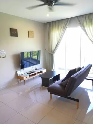 a living room with a couch and a table at The Haven 3 rooms residence Ipoh in Ipoh