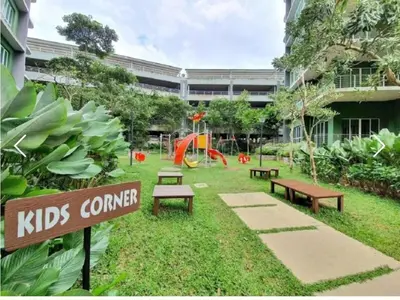 a park with benches and a playground in front of a building at The Haven 3 rooms residence Ipoh in Ipoh