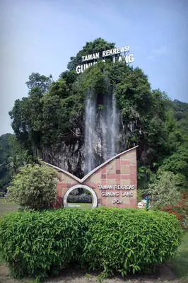 a sign on the side of a mountain with a waterfall at Waterfall Guesthouse 4R3B 12pax 3Car KTV BBQ Pool table in Ipoh