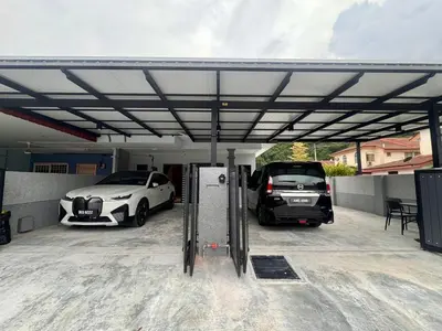 a garage with two cars parked in it at Waterfall Guesthouse 4R3B 12pax 3Car KTV BBQ Pool table in Ipoh