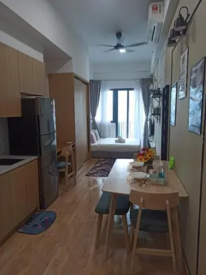 a kitchen and living room with a table and a dining room at Kuala Lumpur in Gua Sai
