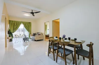 a dining room and living room with a table and chairs at Blissful Escape Perfect Homestay for Families & Friends Brinchang Clover Home 3-03A in Brinchang