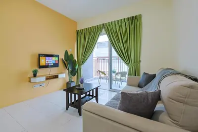 a living room with a couch and a tv at Blissful Escape Perfect Homestay for Families & Friends Brinchang Clover Home 3-03A in Brinchang