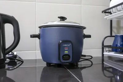 a blue slow cooker sitting on top of a counter at Blissful Escape Perfect Homestay for Families & Friends Brinchang Clover Home 3-03A in Brinchang