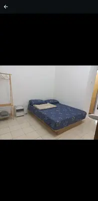 a bed sitting on the floor in a room at Homestay one3nine in Kampong Batu Tiga