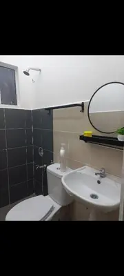 a bathroom with a white toilet and a sink at Homestay one3nine in Kampong Batu Tiga