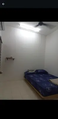 a bedroom with a bed in a white room at Homestay one3nine in Kampong Batu Tiga