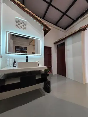 a bathroom with a sink and a mirror at Popular! 4 pax Georgetown Heritage Pre-war House 2 Bedroom in George Town