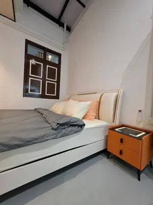 a white room with a bed and a table at Popular! 4 pax Georgetown Heritage Pre-war House 2 Bedroom in George Town