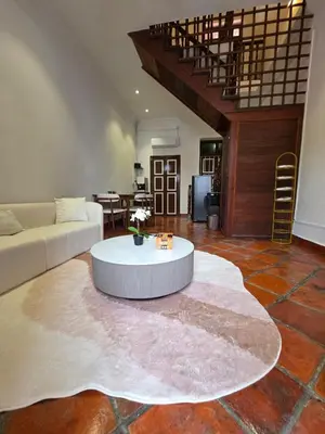 a living room with a couch and a table at Popular! 4 pax Georgetown Heritage Pre-war House 2 Bedroom in George Town