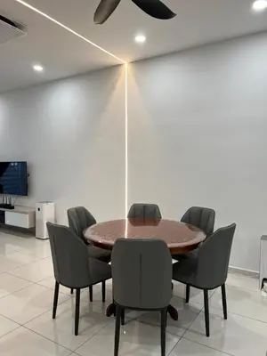 a conference room with a wooden table and chairs at Cozy Home Simpang Ampat in Simpang Ampat
