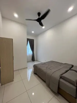 a bedroom with a bed and a ceiling fan at Cozy Home Simpang Ampat in Simpang Ampat