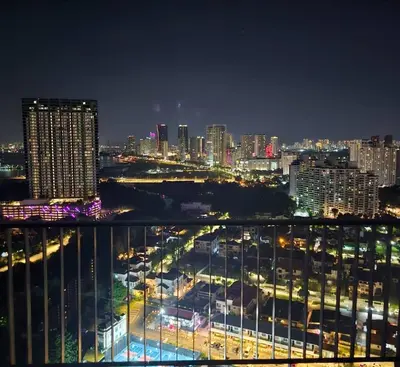 a view of a city at night with buildings at Black Martini Premium Suite in Tanjong Tokong