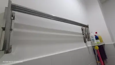 a metal towel rack on a wall in a bathroom at ZIE HOMESTAY AT SOHO Seri Iskandar in Seri Iskandar