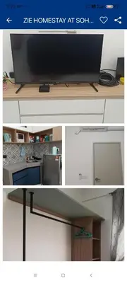 a picture of a flat screen tv on a desk at ZIE HOMESTAY AT SOHO Seri Iskandar in Seri Iskandar