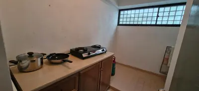 a kitchen with a stove and pots on a counter at A23A5 Silverpark HighFloorView in Bukit Fraser