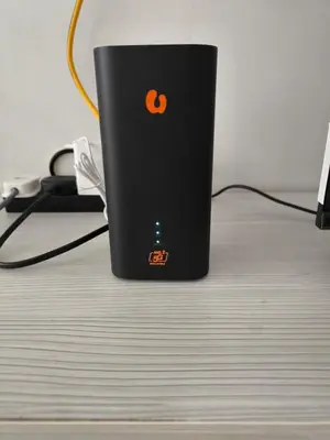 a black computer tower sitting on top of a table at De' Jamboree Homestay in Batu Gajah