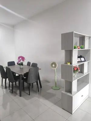 a dining room with a table and chairs at De' Jamboree Homestay in Batu Gajah