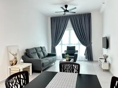 a living room with a couch and a table at NEW Batu Kawan 2 Bedrooms Suite near IKEA-Columbia Asia Hospital-BKIP-UOW Kdu in Simpang Ampat