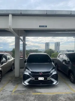 a car is parked in a parking lot at HSL Homestay Meru in Ipoh