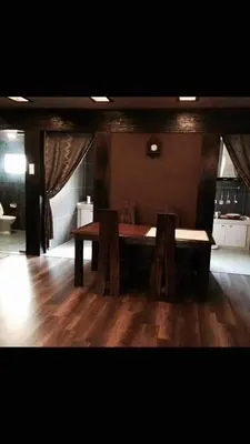a dining room with a table and two chairs at Miracle Suite in Ipoh
