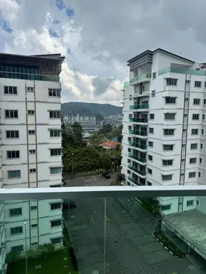 a view of two tall buildings in a city at Ayaan FIFA Hub Quintet House - Ultimate Gaming Stay in Tanah Rata