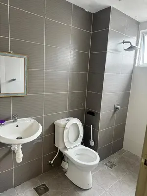 a bathroom with a toilet and a sink at Ayaan FIFA Hub Quintet House - Ultimate Gaming Stay in Tanah Rata