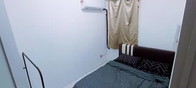 a small bedroom with a bed and a window at 3-Bedroom Homelike Apartment in Bukit Mertajam in Bukit Mertajam