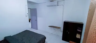 a bedroom with a bed and a television in a room at 3-Bedroom Homelike Apartment in Bukit Mertajam in Bukit Mertajam