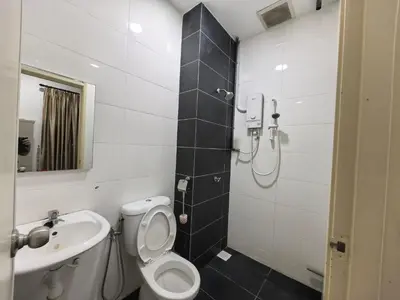 a bathroom with a toilet and a sink at Bertam Holiday Homestay 01 in Kepala Batas