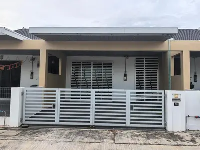 a white fence in front of a house at Bertam Holiday Homestay 01 in Kepala Batas