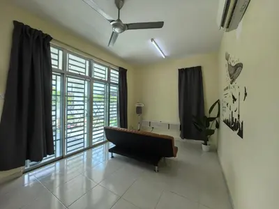 a living room with a couch and a ceiling fan at Padang Serai Wangi Homestay 71 in Padang Serai
