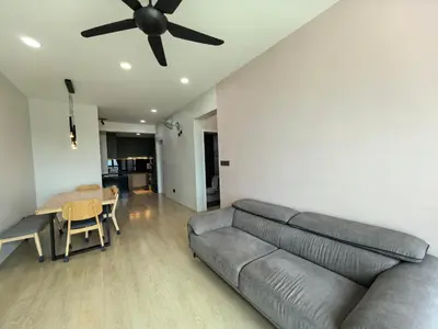 a living room with a couch and a ceiling fan at Meritus Relax Holiday Homestay in Perai