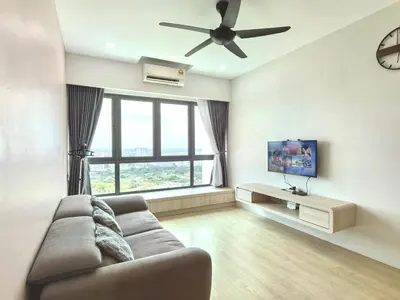 a living room with a couch and a ceiling fan at Meritus Relax Holiday Homestay in Perai