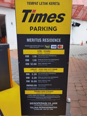 a sign for times parking on a street at Meritus Relax Holiday Homestay in Perai