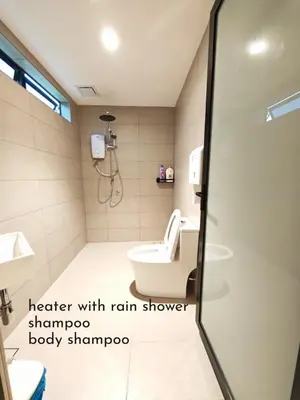 a bathroom with a shower with a toilet and a sink at Mutiara Gurney bySOL at Genesis IVF, Gurney Paragon in George Town