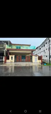 a large building in front of a parking lot at Satis Homestay in Taiping