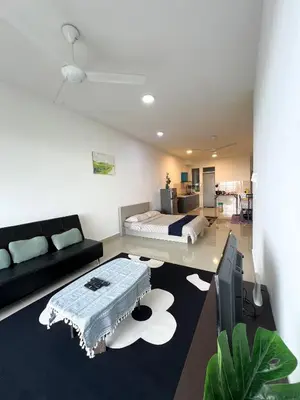 a living room with a bed and a couch at Palas Horizon By Lume' Living Homestay near Kea Farm Market, 2Bedroom, Sunrise View in Brinchang