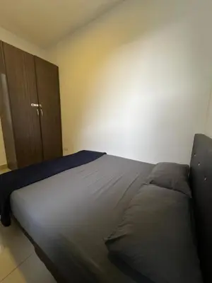a large bed in a room with aigiligiligil at Palas Horizon By Lume' Living Homestay near Kea Farm Market, 2Bedroom, Sunrise View in Brinchang
