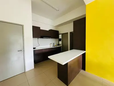 a kitchen with a white counter and a yellow wall at Homestay Golden Hills in Brinchang
