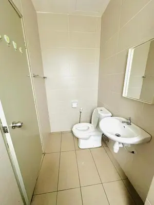 a bathroom with a toilet and a sink at Homestay Golden Hills in Brinchang
