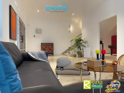 a living room with a couch and a table at MalayaVilla 5R3B16Pax PrivatePool Karaok PlayGround in Gua Sai